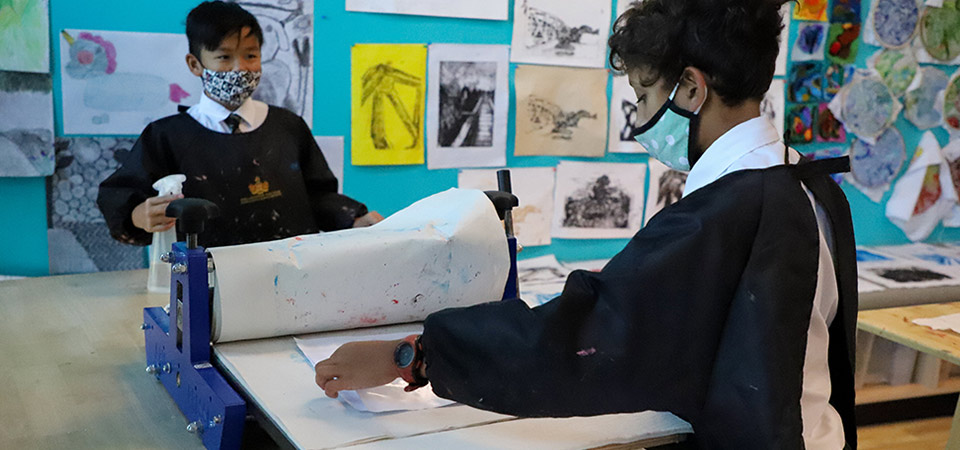 Students using a printing press