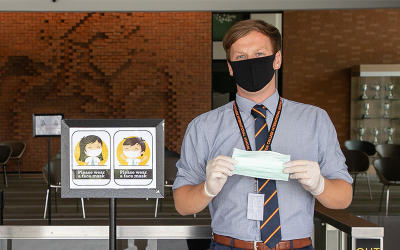 Wellington College Bangkok staff member with mask on