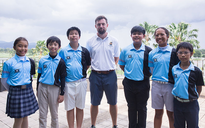 Mr Jon Fudge with Wellington College golf students